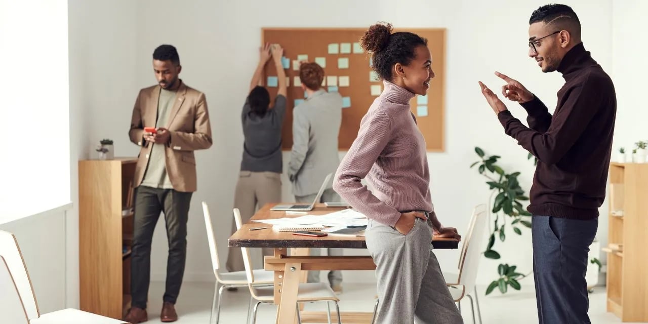 Employees discussing a project