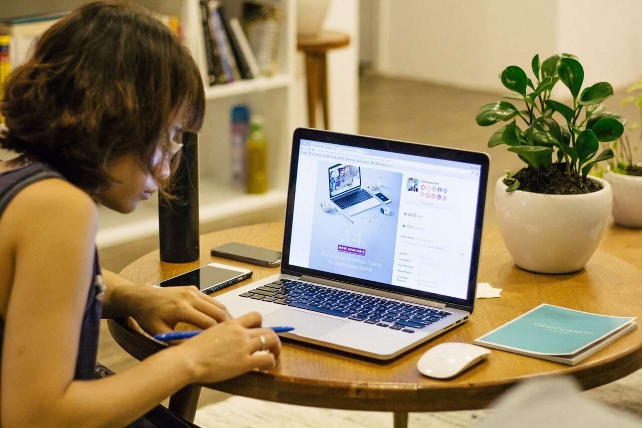 Woman working on laptop in an office space